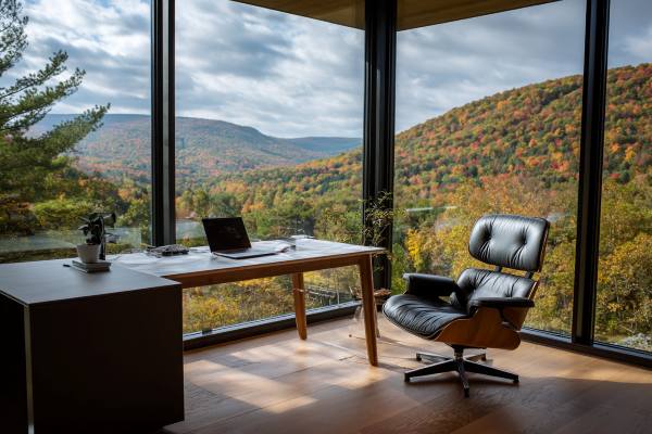 empty executive chair in an office overlooking picturesque Vermont mountains