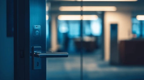 Closeup of an office's glass door closing