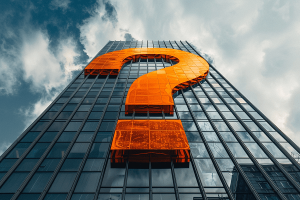 An orange question mark on the side of a skyscraper