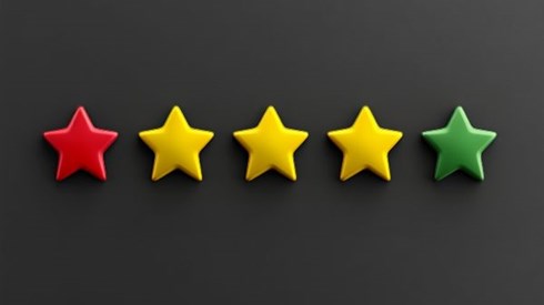 one red star, three yellow stars, one green star in a horizontal row