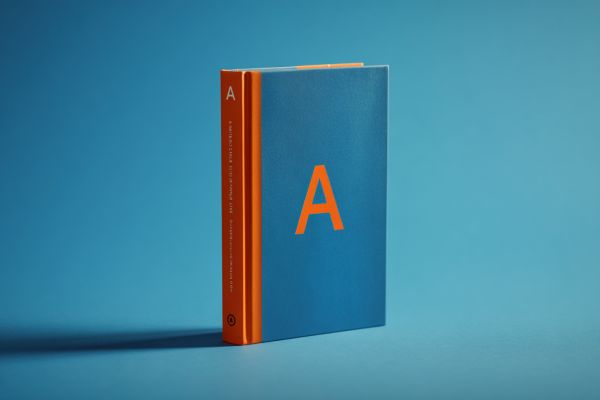 blue and orange standing book with the letter "A" on it on a blue background
