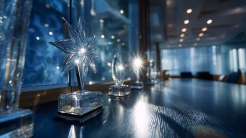 starburst of light glinting off a glass trophy in a boardroom