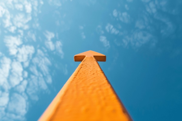 An orange arrow shooting up into the sky
