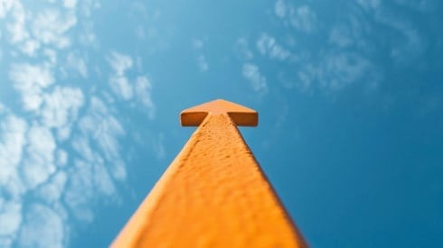 An orange arrow shooting up into the sky