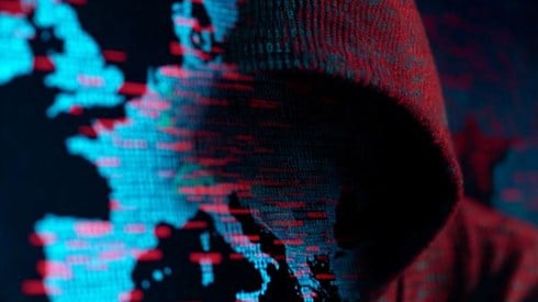 red hooded figure blending into a blue binary code map of Europe