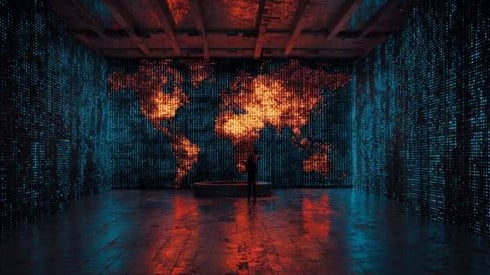 global map of the world in red surrounded by blue binary code on walls of a large high-tech room.