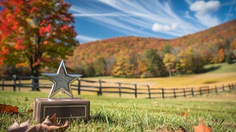 View of the Vermont countryside in the autumn season with a star trophy on the ground.
