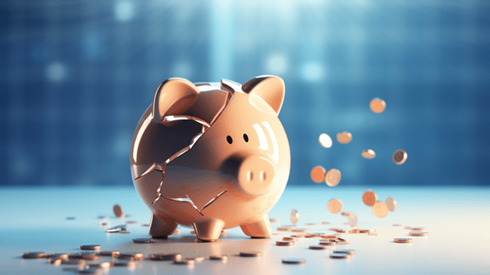 A cracked piggy bank with change falling and on the floor around it