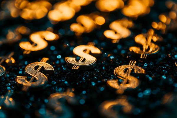 closeup of tiny gold dollar signs