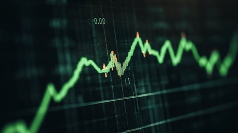 A green line graph trending upwards