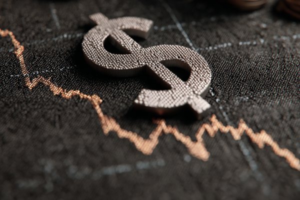 A money sign above a rapidly decreasing line graph