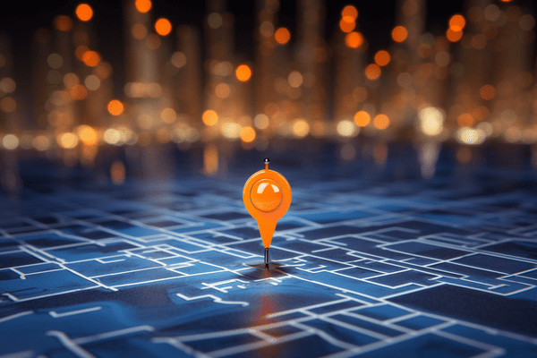 Orange Pin Dot Marks Location on Flat Map Surface with Muted Points of Light in Background