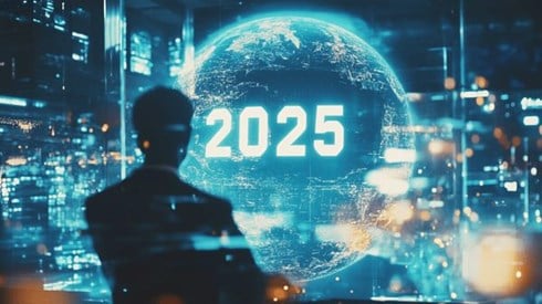 A businessman standing in front of a hologram of a globe with 2025 written on it in an office building