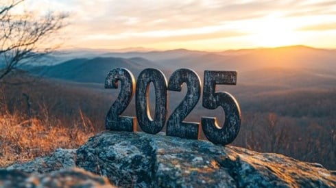 the numbers 2025 in front of a mountain sunrise