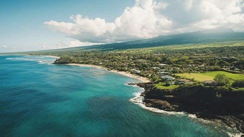Houses dotting the coastline of Hawaii