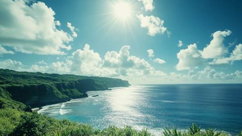 blue ocean and green mountain beach with sun in the blue sky in the Northern Mariana Islands