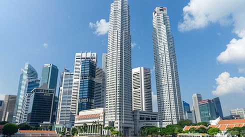 A view of skyscrappers by the water.