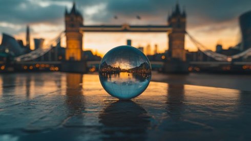 clear globe in front of UK bridge