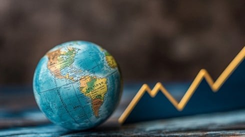 A globe next to a line graph that is trending upward