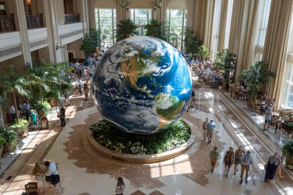 large digital globe in the middle of a hotel lobby