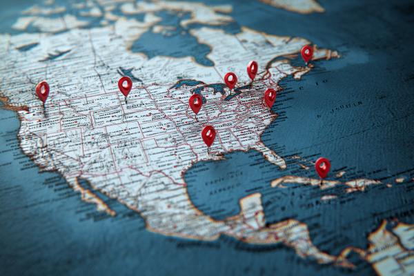map of North America with red google map markers in various cities