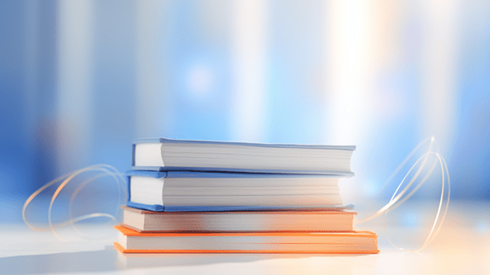 Stack of books sitting on table
