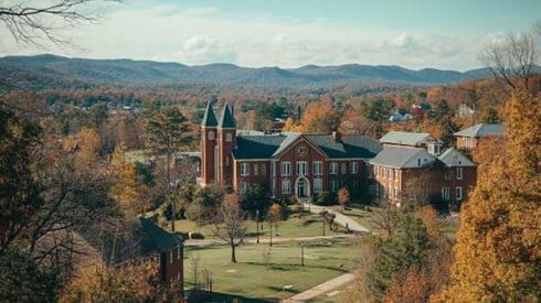 collegiate campus buildings in Arkansas with the Ozark mountains in the background