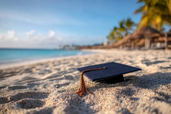 graduation cap on a Cayman Islands beach