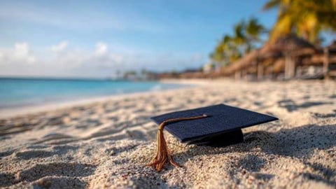 graduation cap on a Cayman Islands beach
