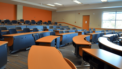 University classroom with rows of desks