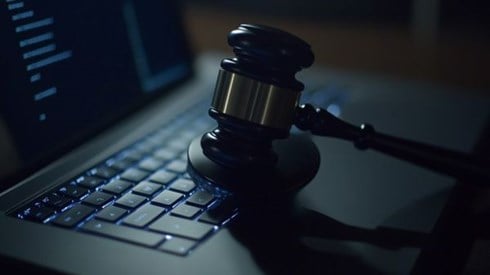 legal gavel on top of a laptop keyboard
