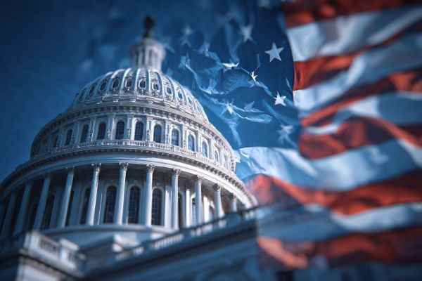 angled view of the US Capitol building with a US flag overlaid on top