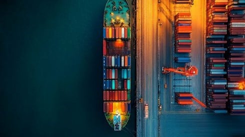 overhead view of a shipping container ship at a dock