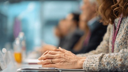Business people talking around a conference table
