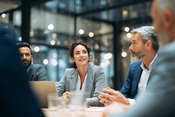 A group of businesspeople talking at a table