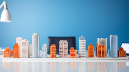 A row of small buildings laid on on a desk