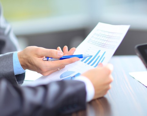 Business professionals looking at an actuarial report