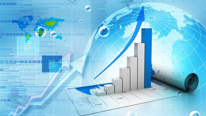 Business bar chart with arrows and graph rising on top of a map of the world on the left and a globe on the right