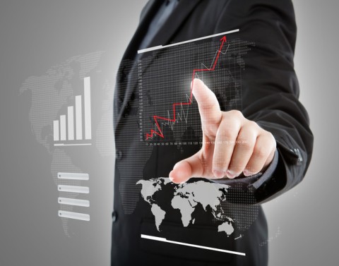 Businessman touching graph