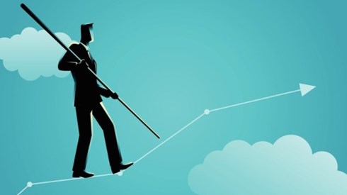 Businessman walking a tightrope up arrow