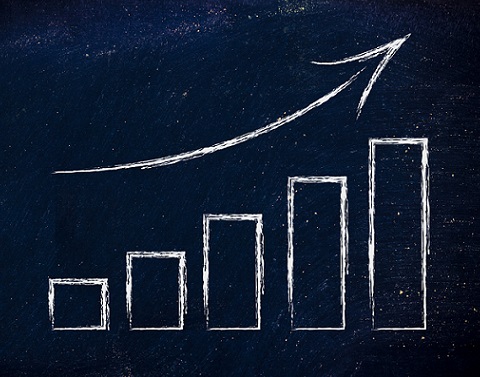 Drawing of graph with arrowing curving upward on dark background