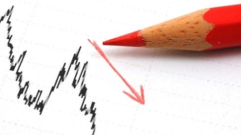 Black line graph with red pencil and red arrow showing negative trend line