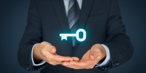 Businessman Holding Glowing Key