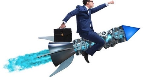 Businessman on Dollar Sign Rocket