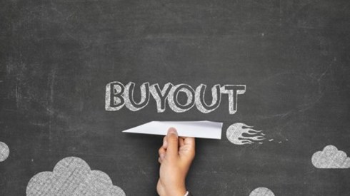 A businessman holds a paper plane in front of a blackboard that has drawings of clouds and the word BUYOUT