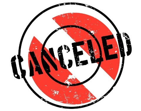 A red circle with a white line through it and the word canceled over it in black