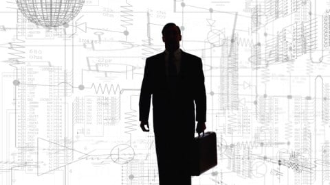 A silhouette of a businessman standing and holding a briefcase against a white background filled with gray technical drawings