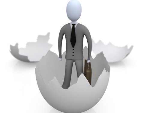 A 3D bubble businessman figure is standing in the base of hatched egg with the two upper sides of the egg in background