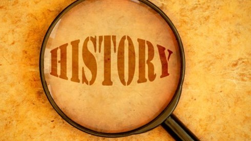 The word HISTORY shown through magnifying glass