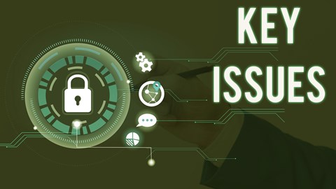 Businessperson hand in murky background writing while padlock and other icons indicating critical topics float with words KEY ISSUES